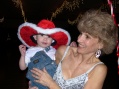 Patti holds Zander in Art's holiday hat